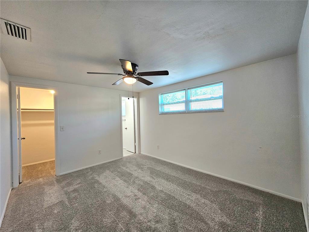 611 Lyndhurst Street Dunedin, FL 34698 - Photo 22 of 62 a view of an empty room with a window