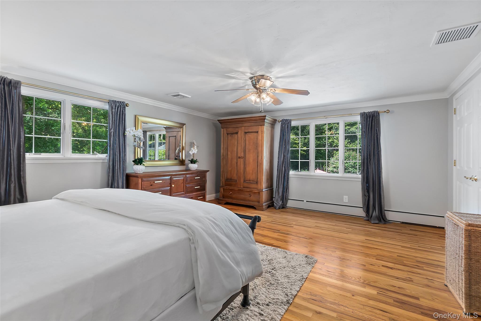 12 Sugar Hill Road North Salem, NY 10560 - Photo 14 of 34 a spacious bedroom with a large bed a chandelier and windows