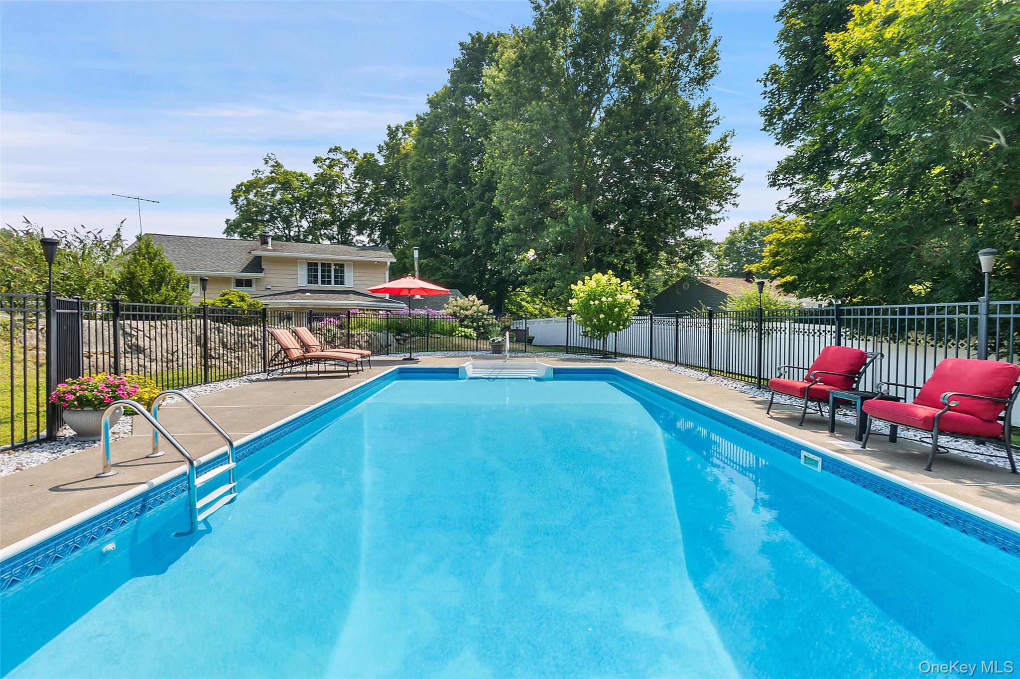 12 Sugar Hill Road North Salem, NY 10560 - Photo 23 of 34 a view of a swimming pool with a couches and a patio