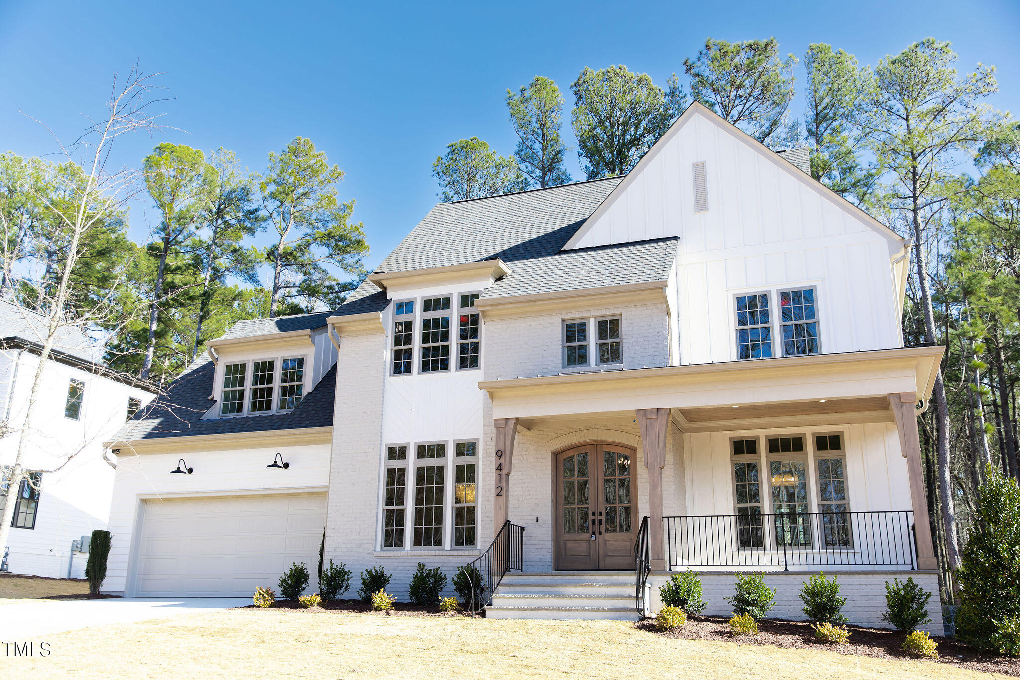 a view of a white house with a yard