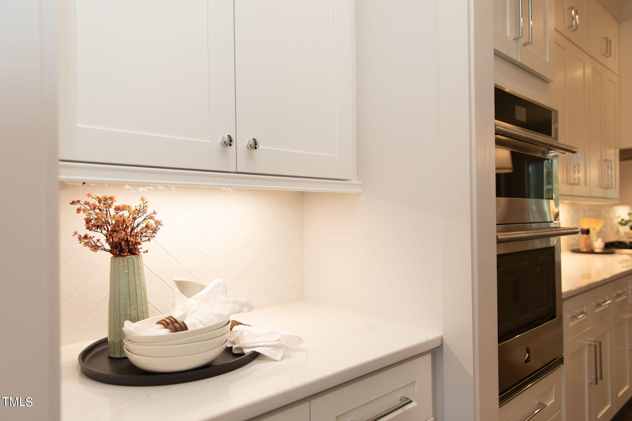 9412 Rawson Avenue Raleigh, NC 27613 - Photo 11 of 53 a kitchen with a sink and a refrigerator