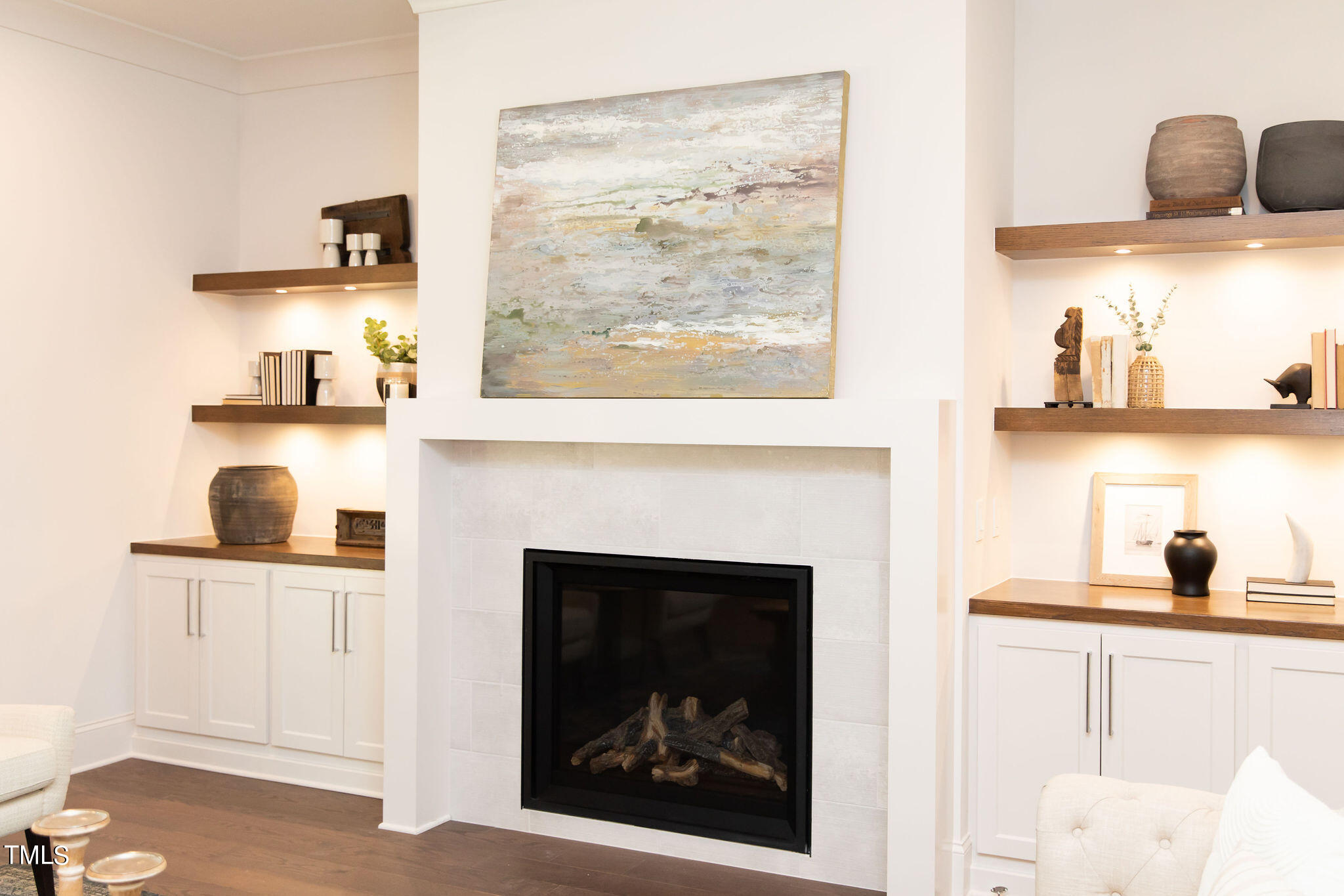 9412 Rawson Avenue Raleigh, NC 27613 - Photo 15 of 53 a living room with furniture and a fireplace