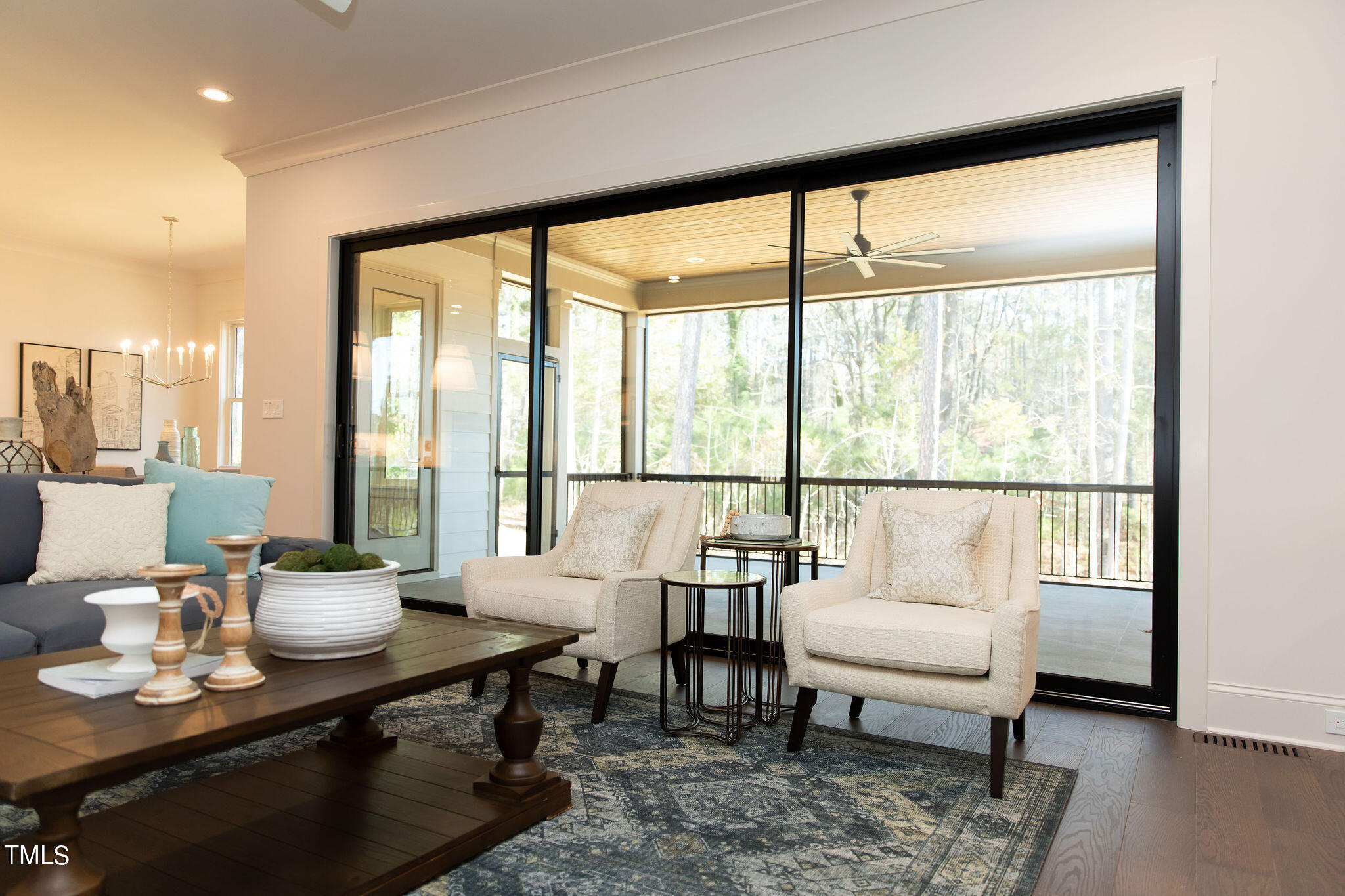 9412 Rawson Avenue Raleigh, NC 27613 - Photo 18 of 53 a living room with furniture and a large window