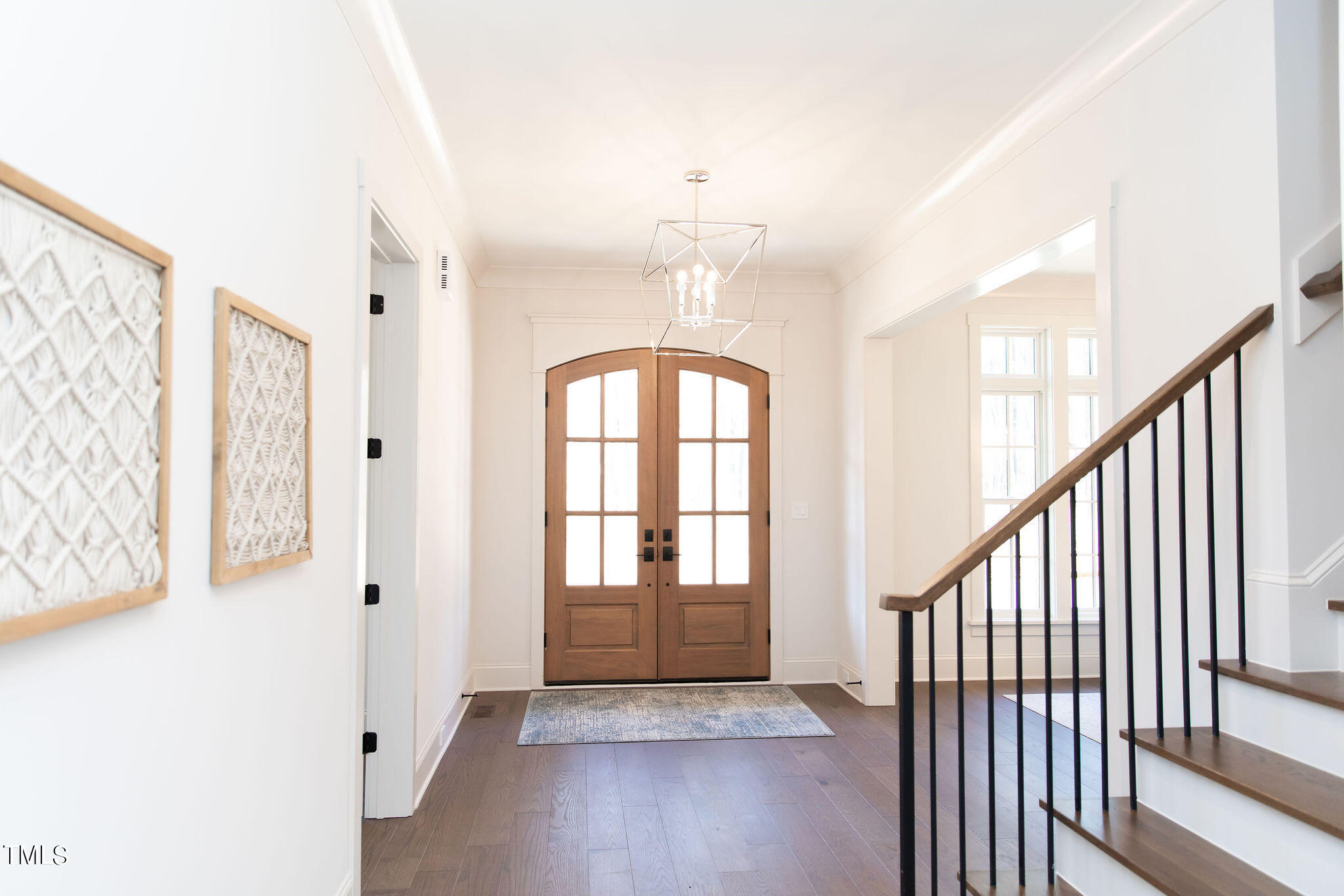 9412 Rawson Avenue Raleigh, NC 27613 - Photo 2 of 53 a view of an entryway with wooden floor