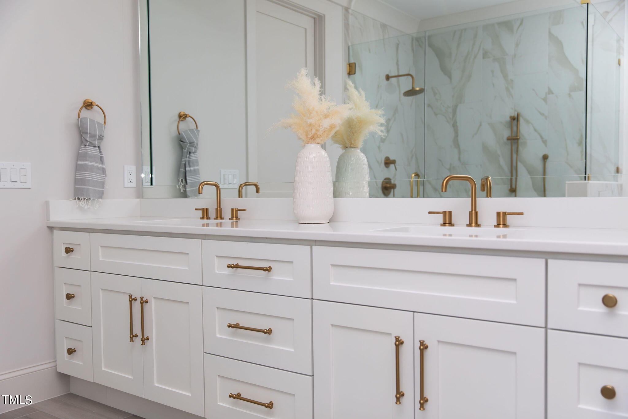 9412 Rawson Avenue Raleigh, NC 27613 - Photo 21 of 53 a bathroom with white cabinets and a sink