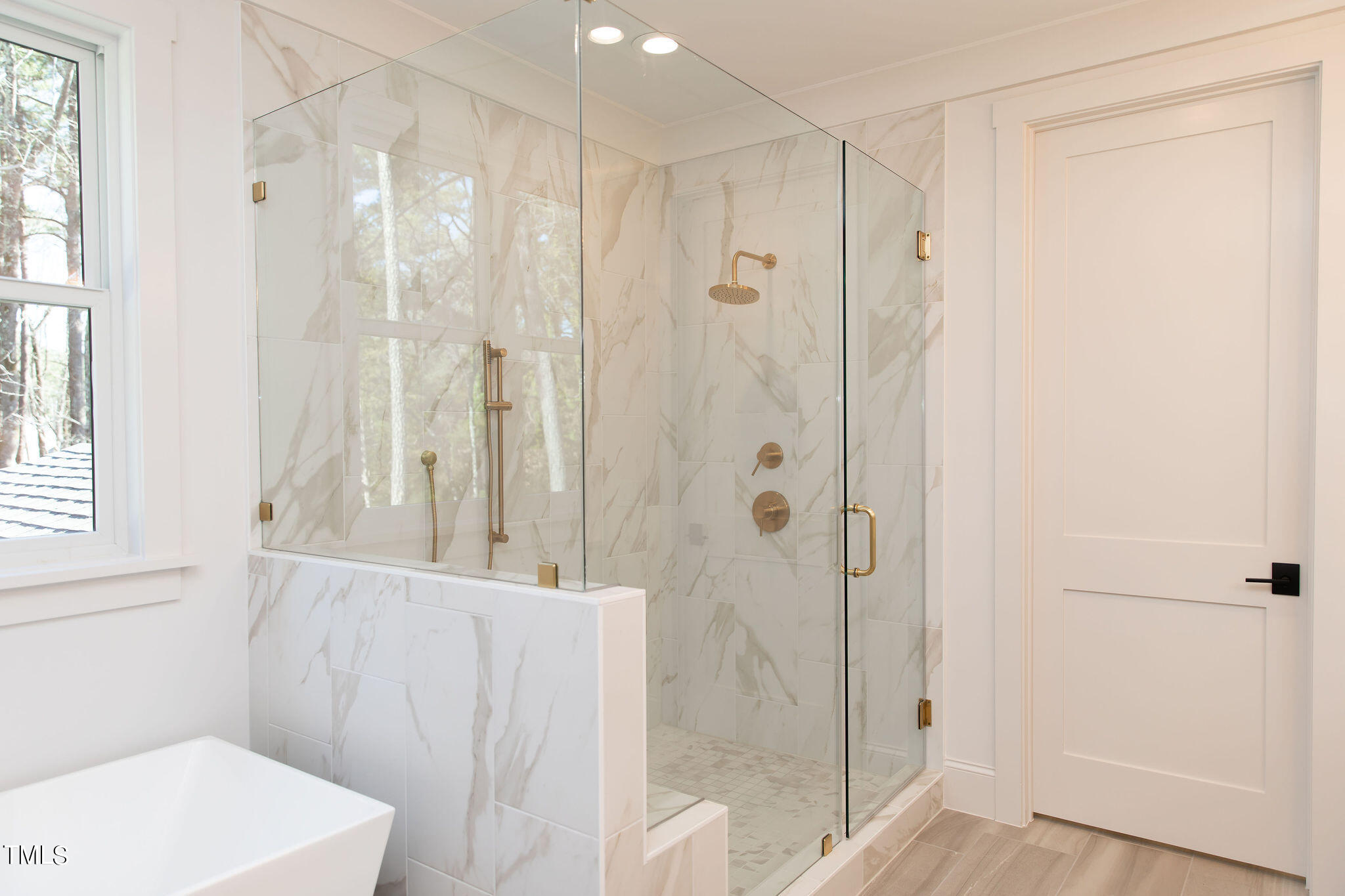 9412 Rawson Avenue Raleigh, NC 27613 - Photo 23 of 53 a bathroom with a shower and a sink
