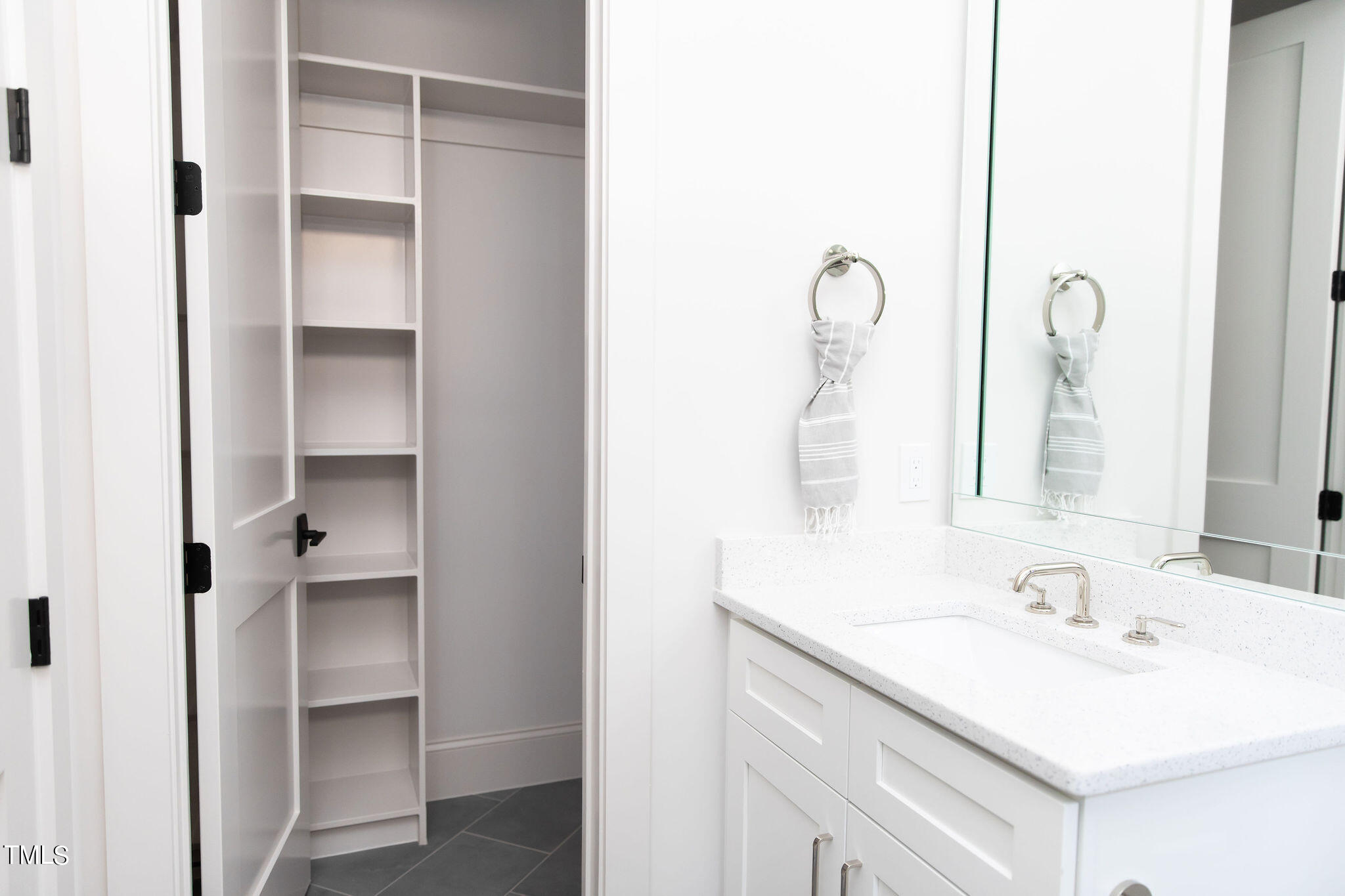 9412 Rawson Avenue Raleigh, NC 27613 - Photo 28 of 53 a bathroom with a sink and a mirror