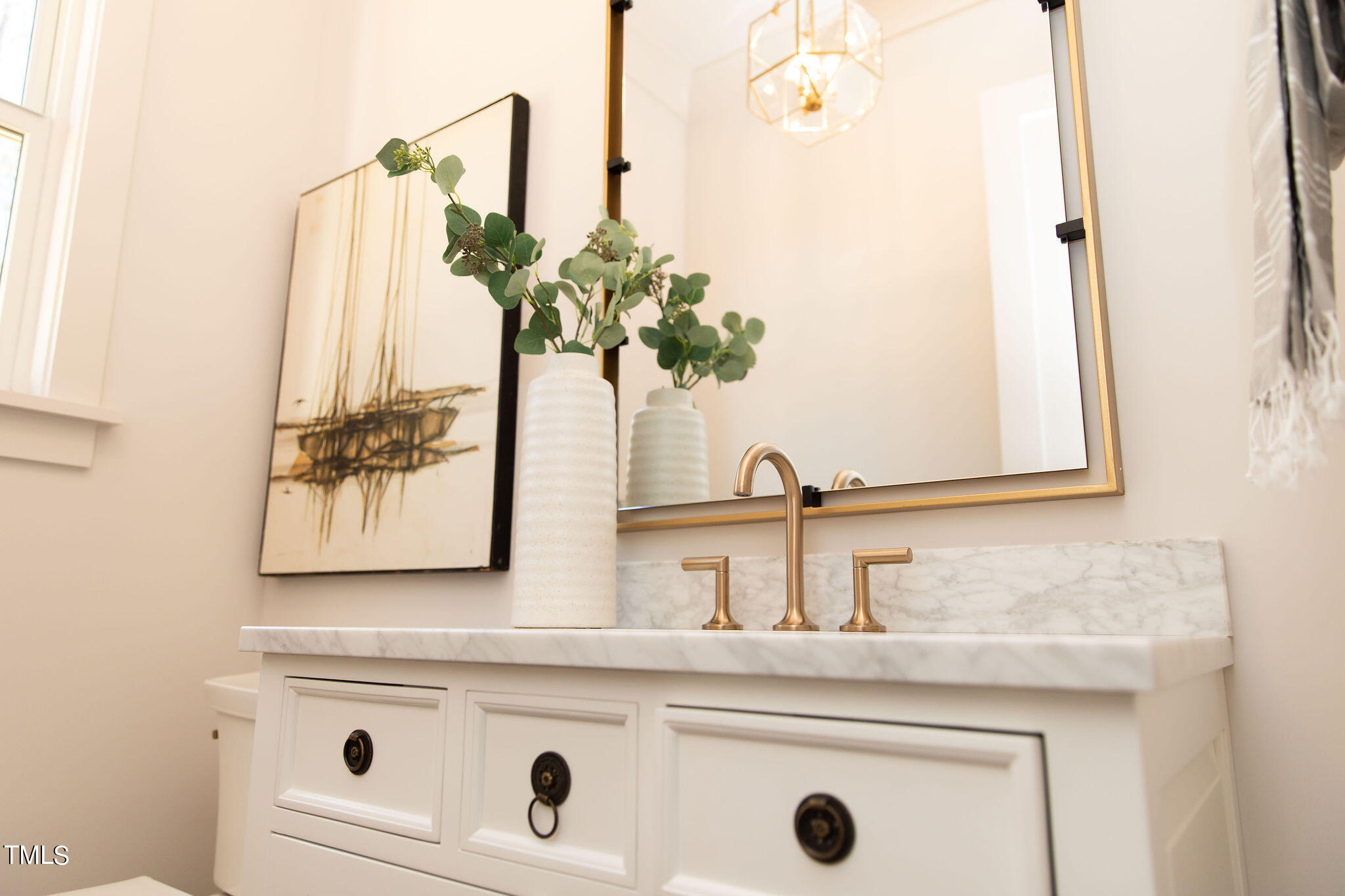 9412 Rawson Avenue Raleigh, NC 27613 - Photo 32 of 53 a bathroom with a sink and a mirror