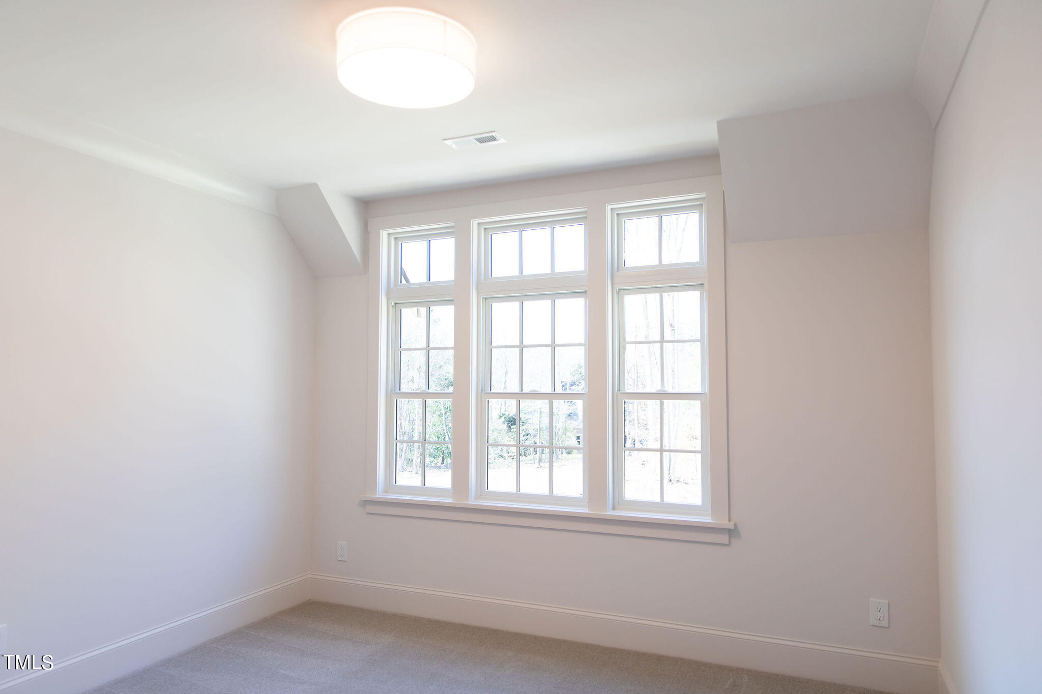 9412 Rawson Avenue Raleigh, NC 27613 - Photo 33 of 53 an empty room with a window