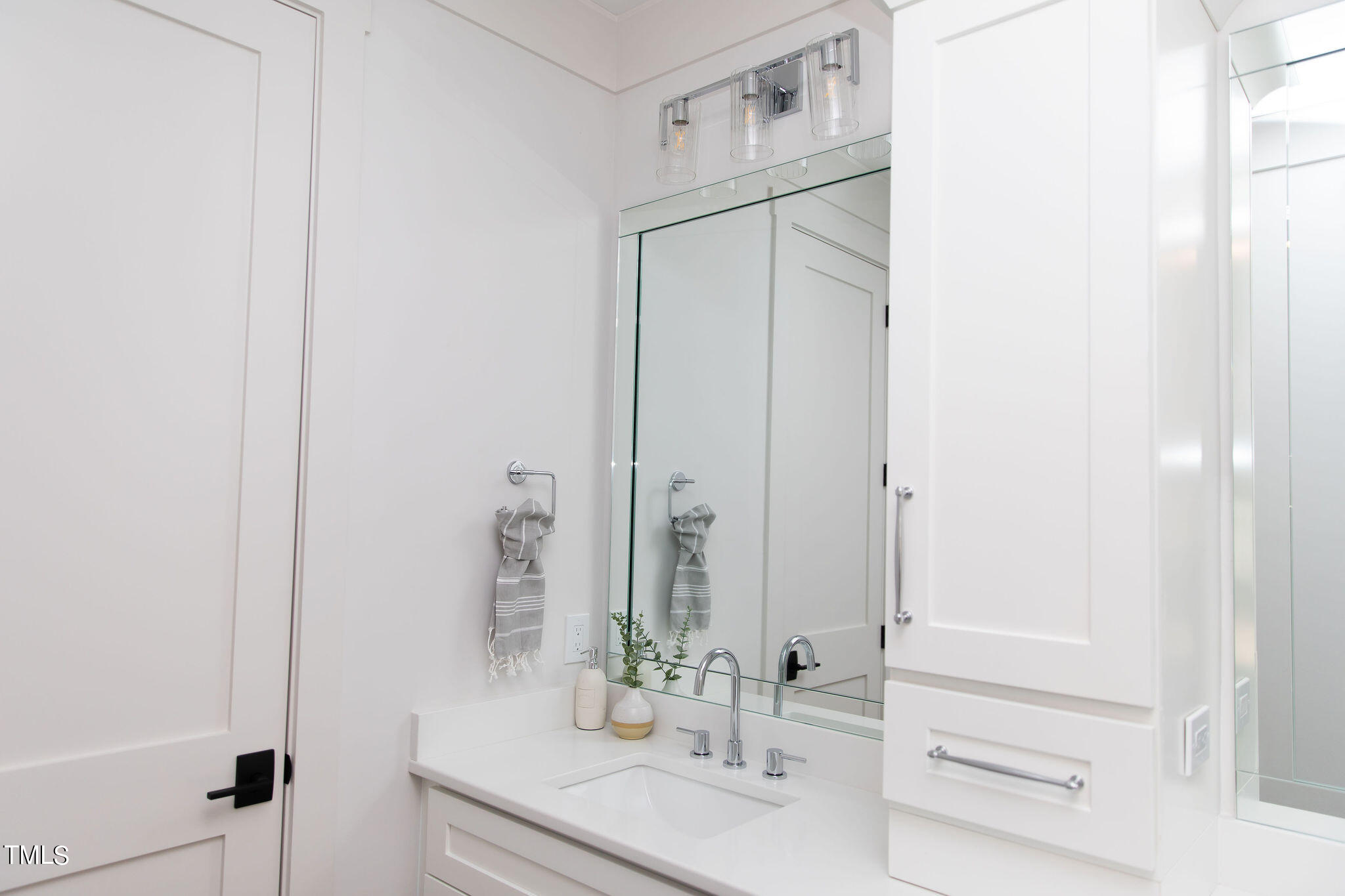 9412 Rawson Avenue Raleigh, NC 27613 - Photo 34 of 53 a bathroom with a sink and a mirror