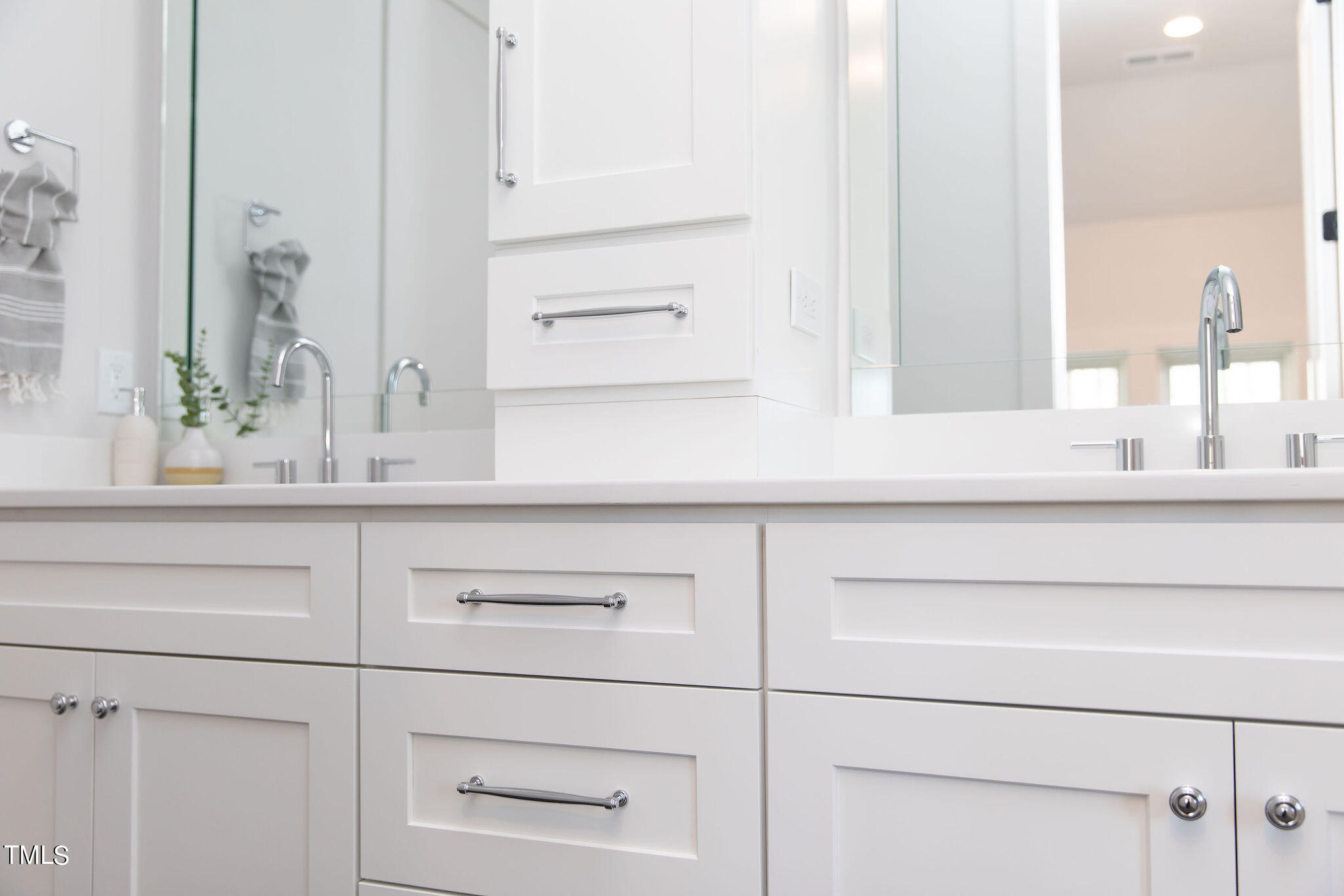 9412 Rawson Avenue Raleigh, NC 27613 - Photo 35 of 53 a bathroom with a sink and a mirror