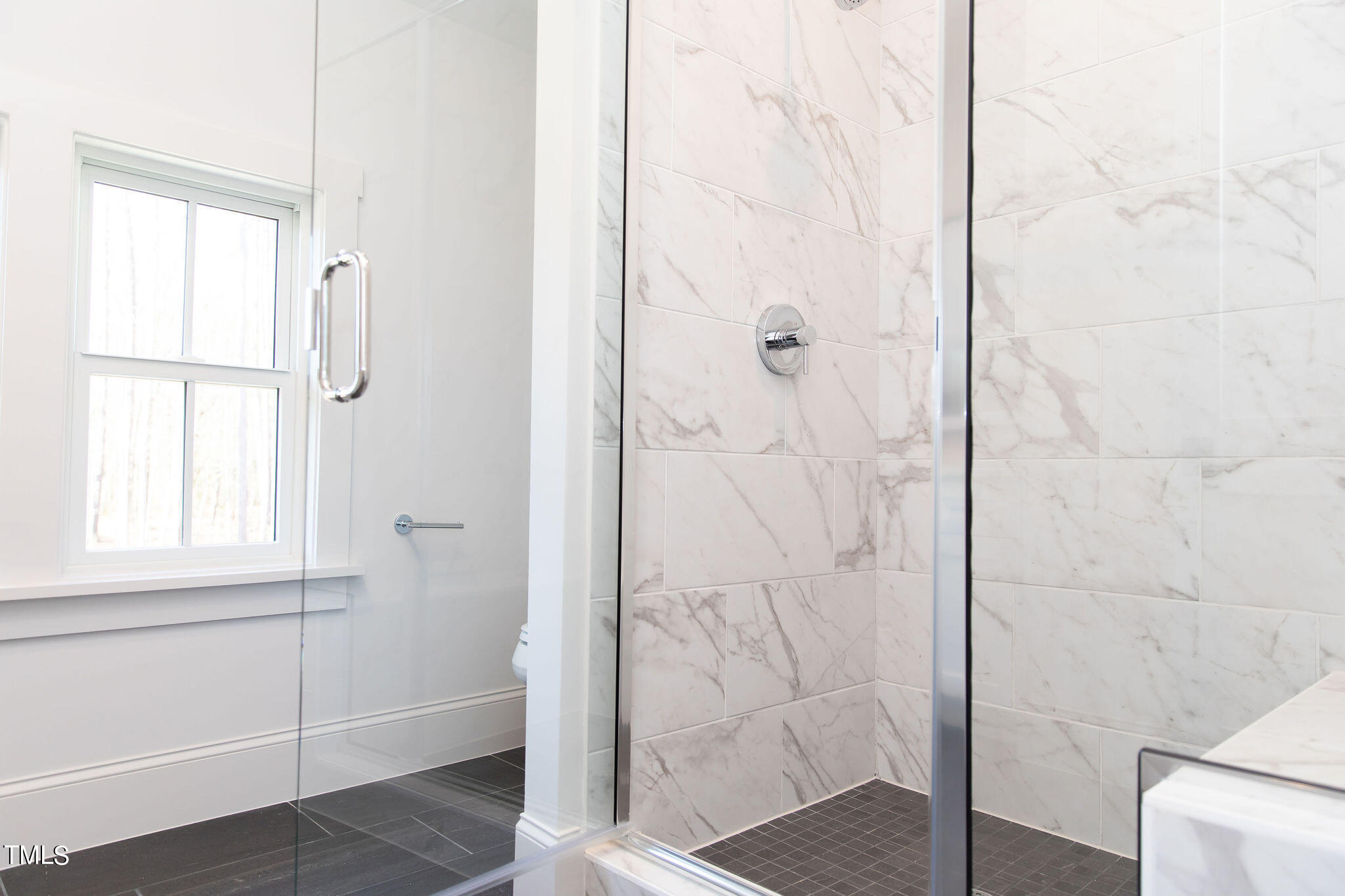 9412 Rawson Avenue Raleigh, NC 27613 - Photo 36 of 53 a bathroom with a shower