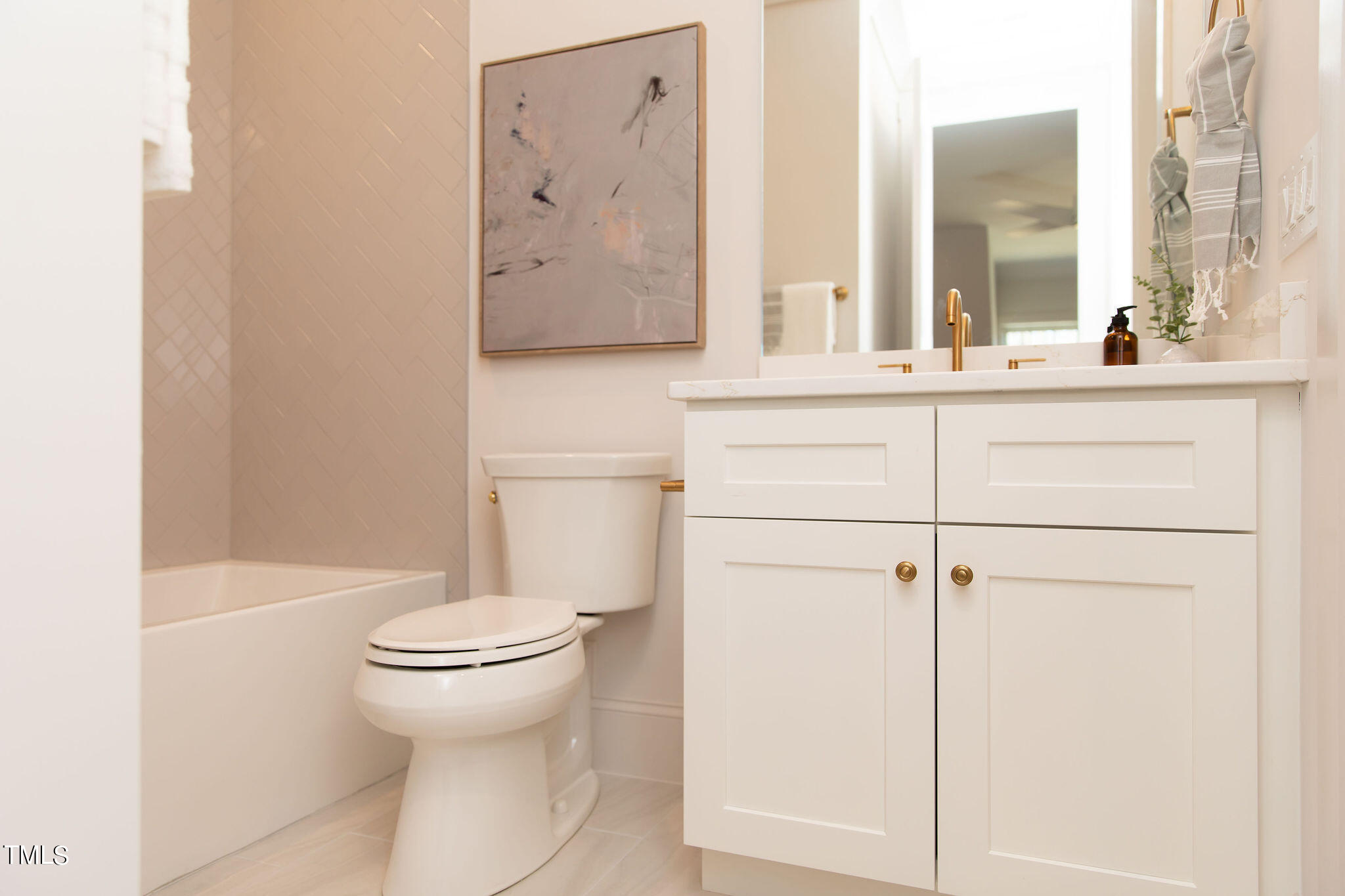9412 Rawson Avenue Raleigh, NC 27613 - Photo 39 of 53 a bathroom with a toilet sink and mirror