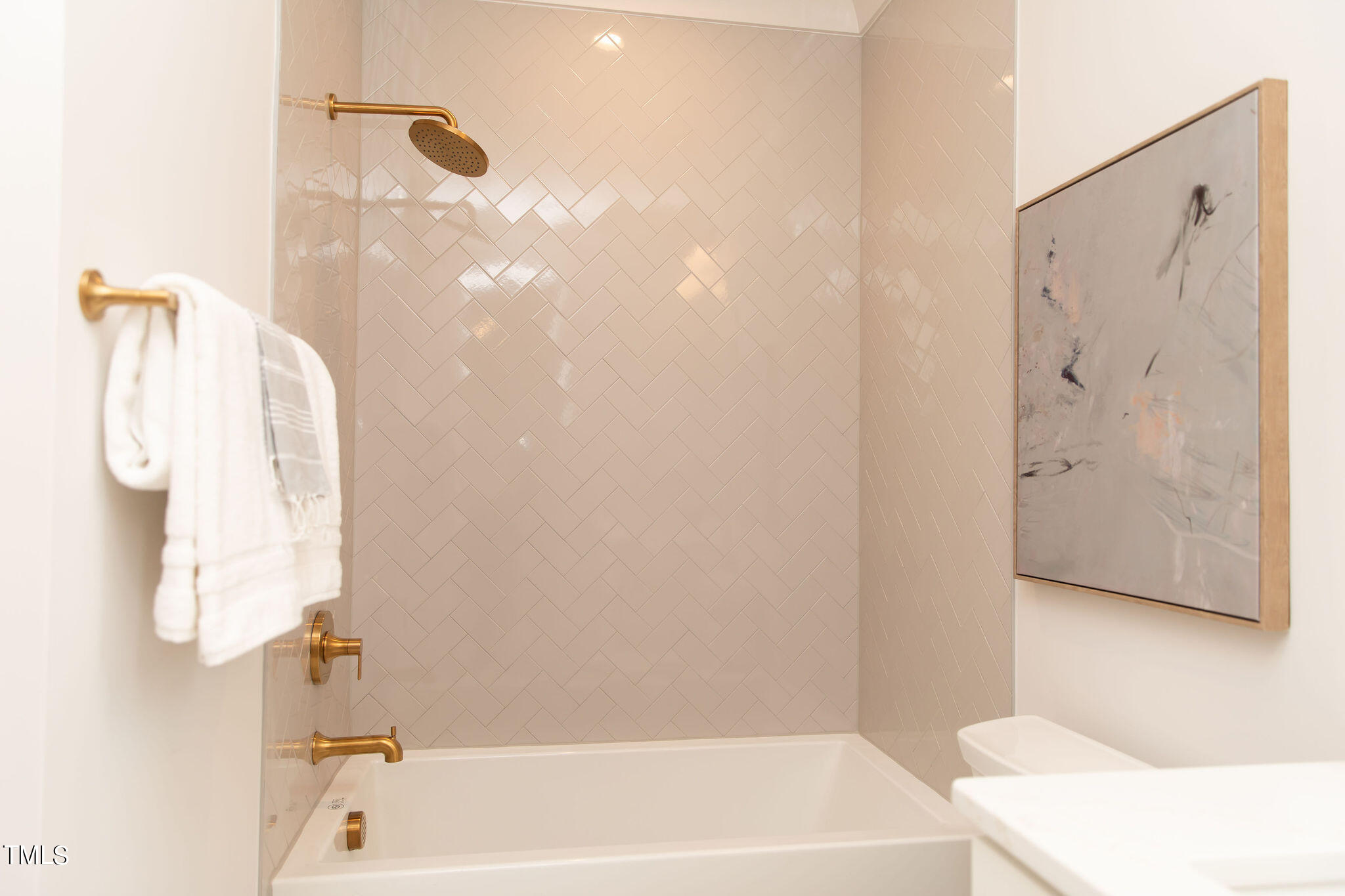 9412 Rawson Avenue Raleigh, NC 27613 - Photo 40 of 53 a bathroom with a bathtub and a shower