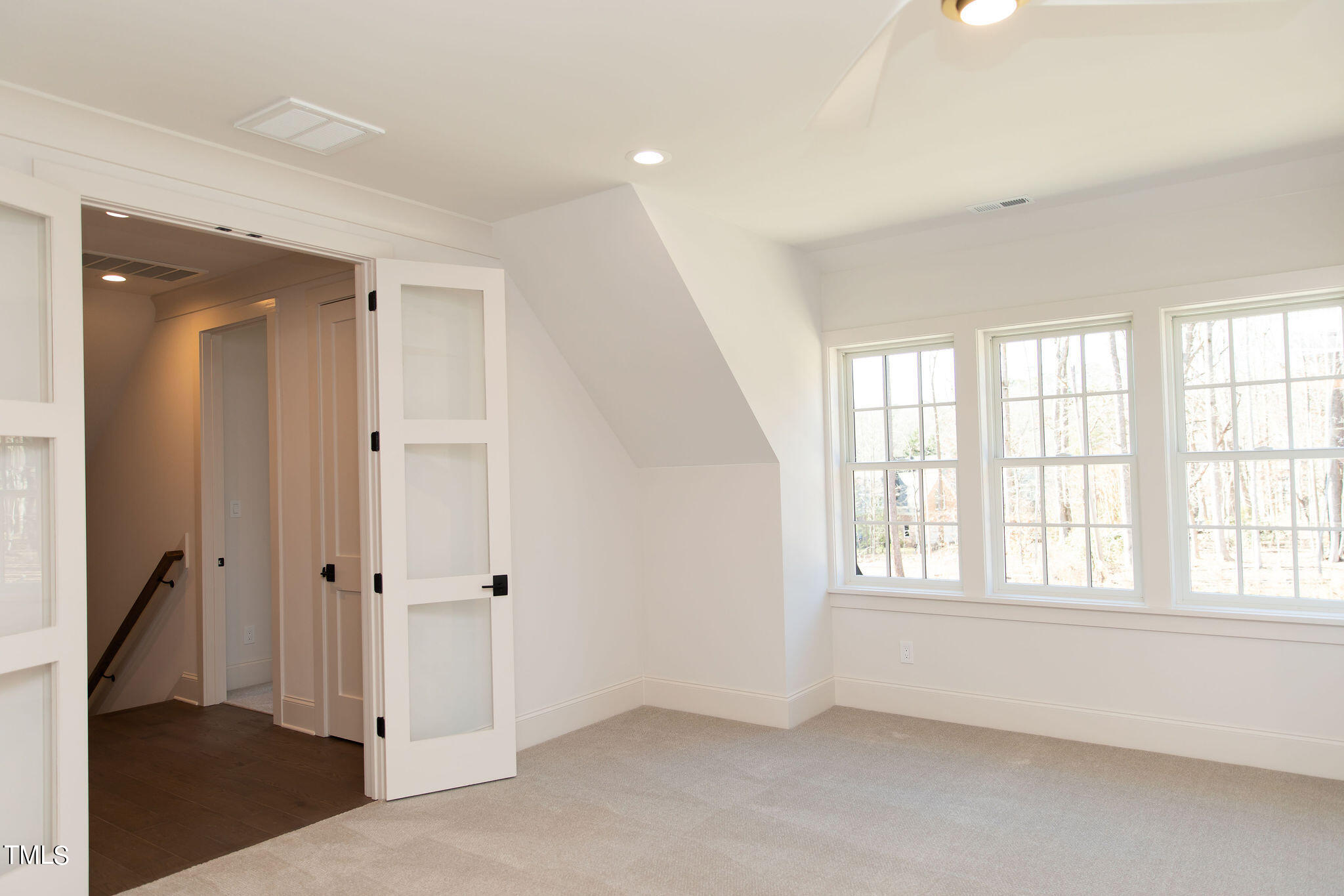 9412 Rawson Avenue Raleigh, NC 27613 - Photo 42 of 53 an empty room with windows and closet