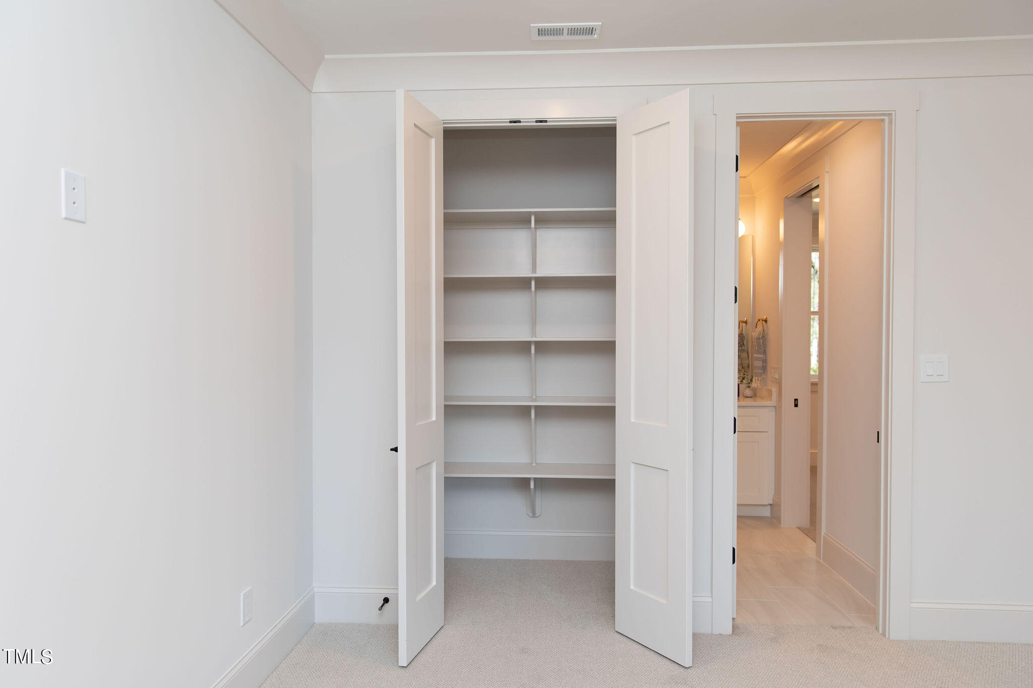 9412 Rawson Avenue Raleigh, NC 27613 - Photo 49 of 53 a view of an empty room with closet and a window
