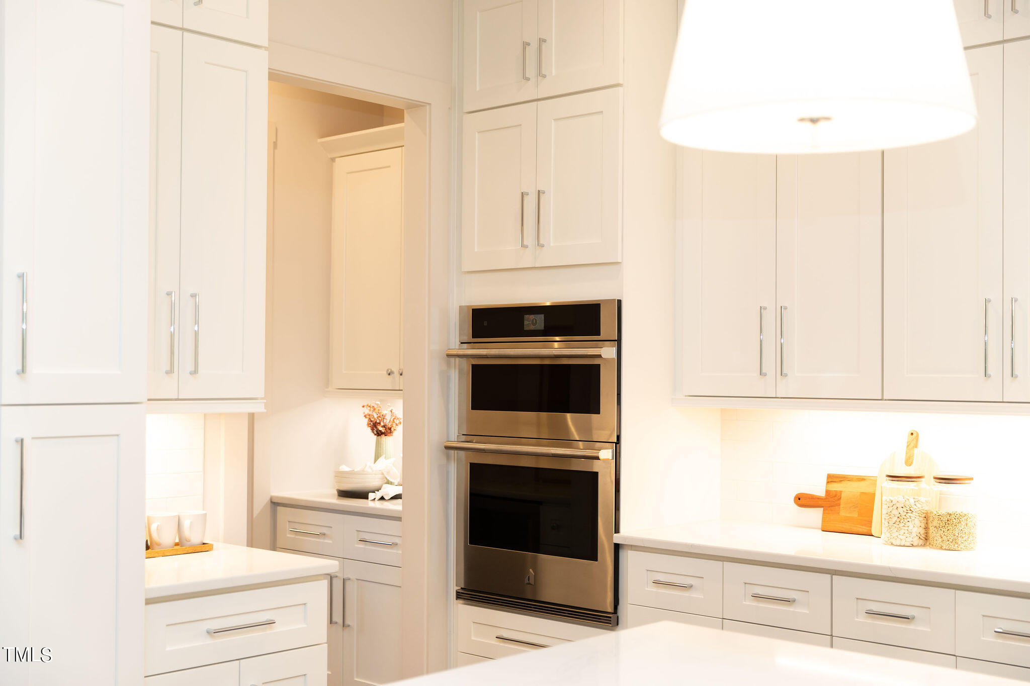 9412 Rawson Avenue Raleigh, NC 27613 - Photo 8 of 53 a kitchen with cabinets and appliances