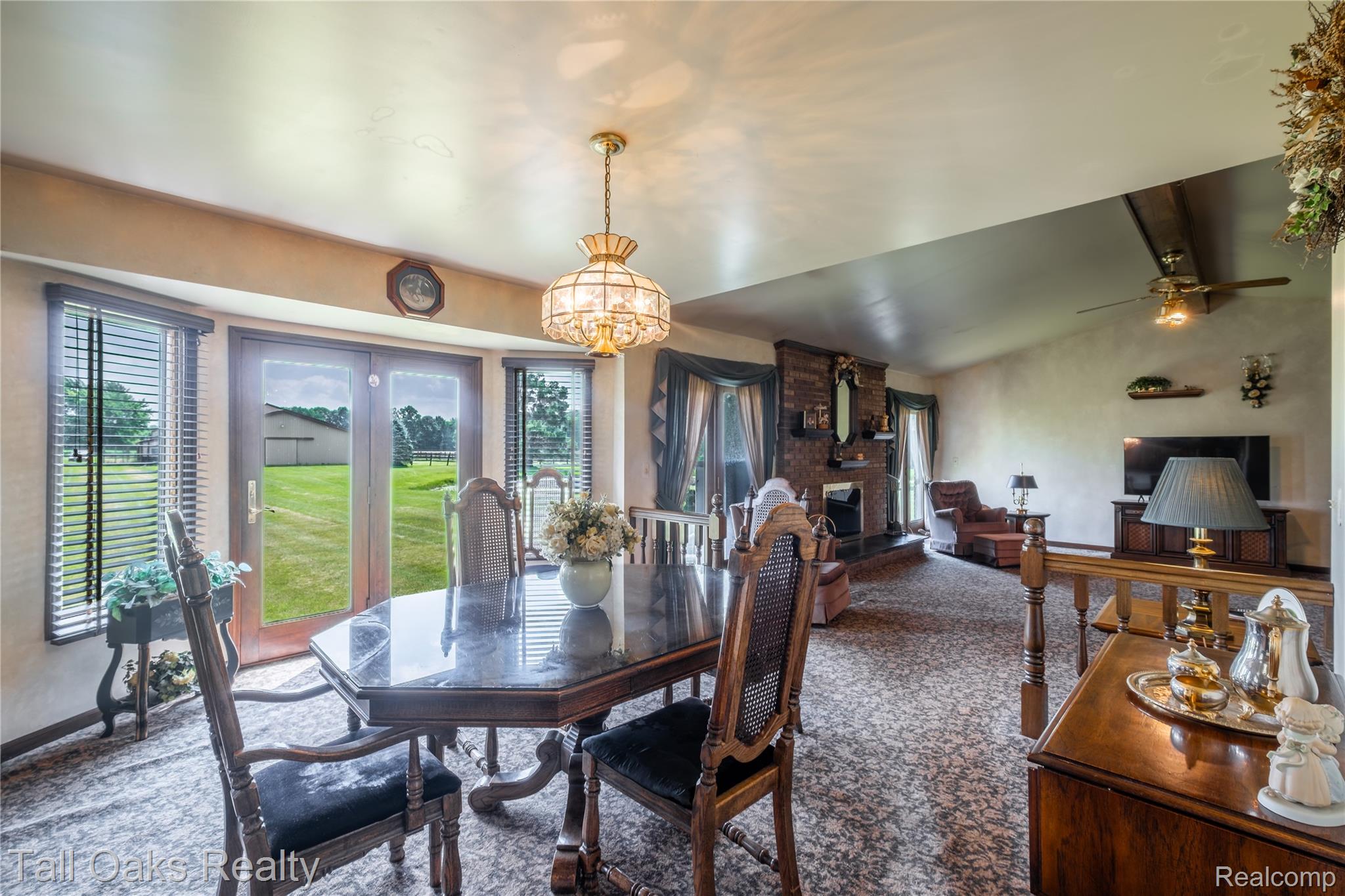 79330 Capac Road Armada, MI 48005 - Photo 23 of 42 Dining area with bay window and double glass doors opening to a lush green lawn