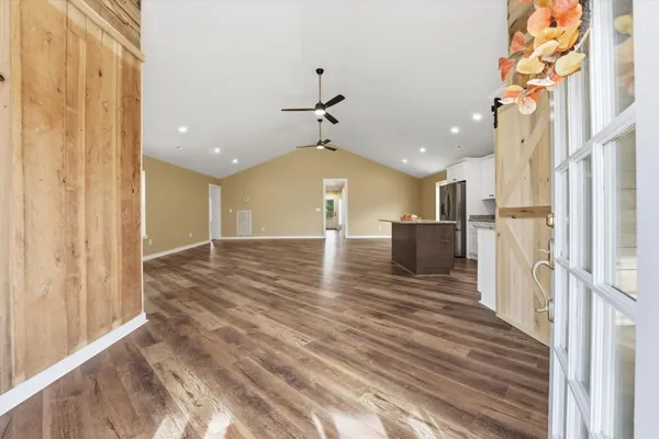 a view of an entryway with wooden floor