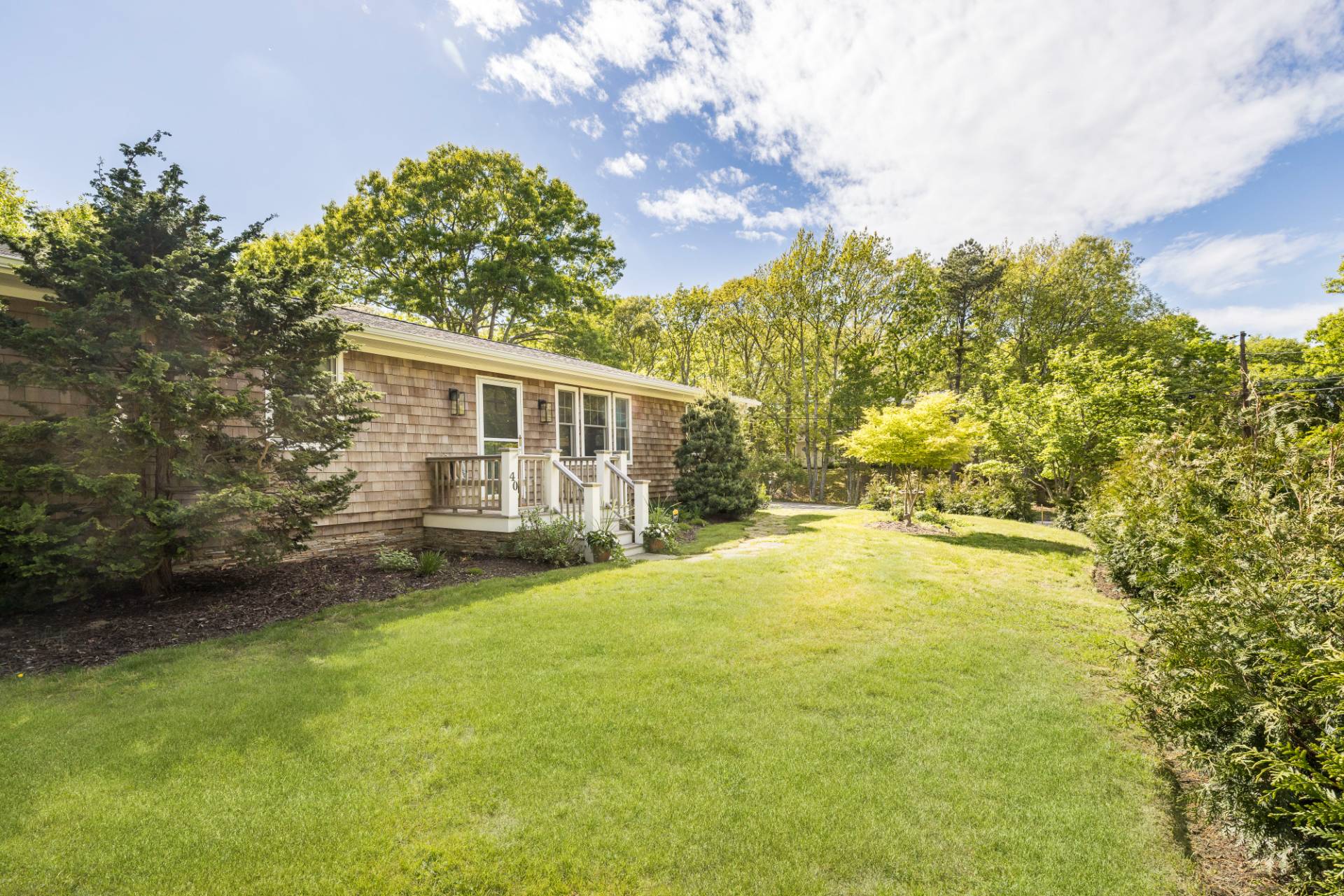 40 Ridge Road West Sag Harbor, NY 11963 - Photo 25 of 27 a view of a house with a yard and sitting area