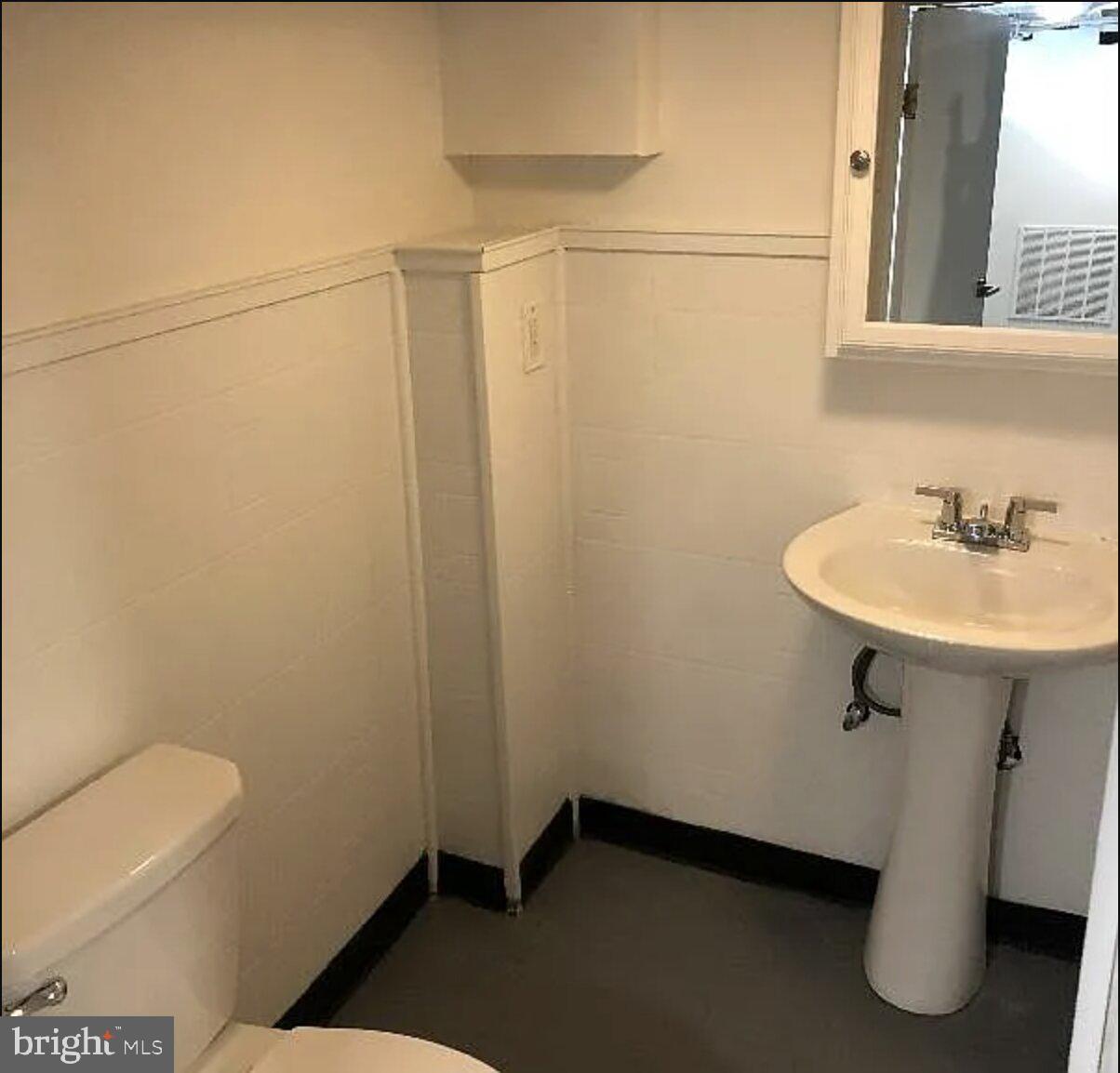 5 Coates Street Bridgeport, PA 19405 - Photo 20 of 28 a bathroom with a sink toilet and a mirror