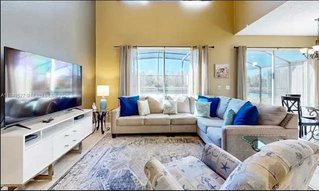 a living room with furniture and a flat screen tv