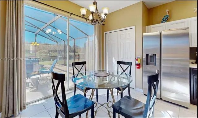 a view of a dining room with furniture window and outside view
