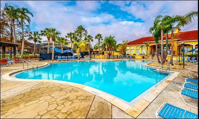 a view of a swimming pool with a lounge chairs