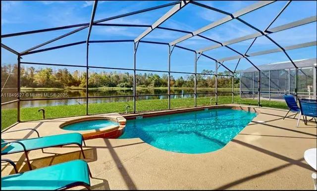 a view of a swimming pool with a patio