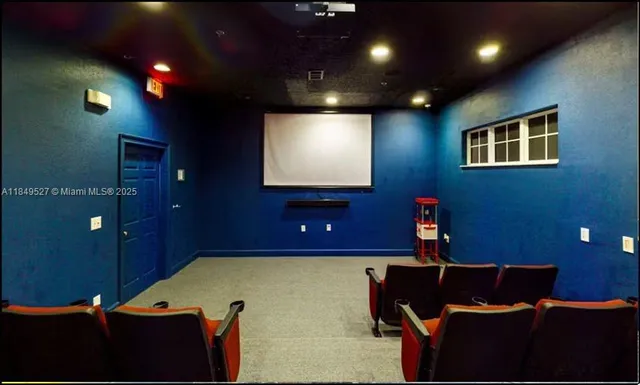 a room with pool table and windows