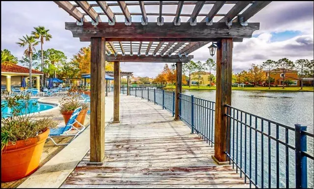 a view of a house with swimming pool and porch