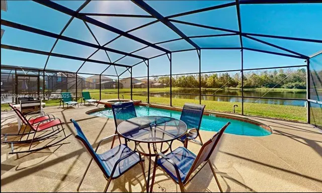 a view of swimming pool with a patio
