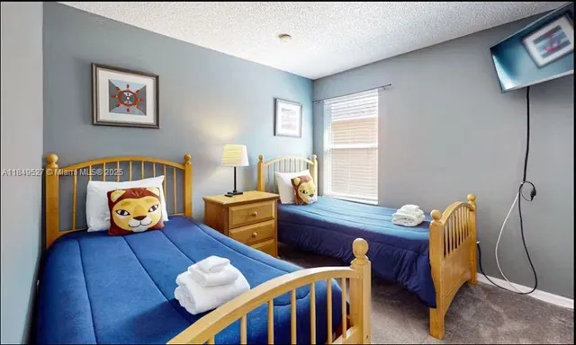 a bedroom with furniture and a window