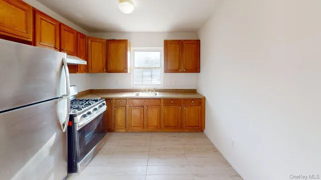 a bathroom with a bathtub shower sink vanity and toilet