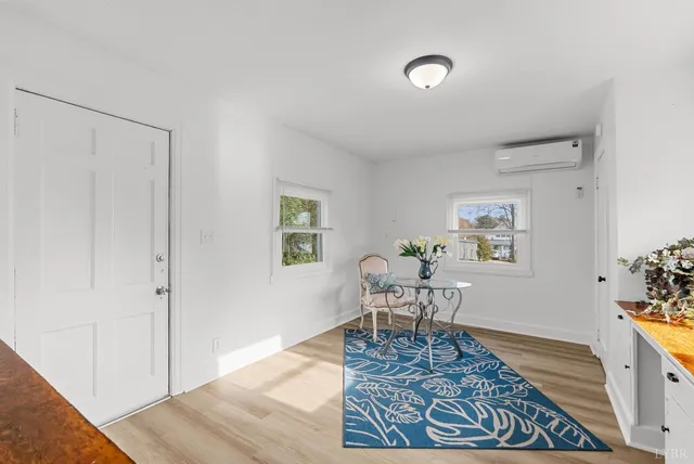 a living room with furniture and a rug