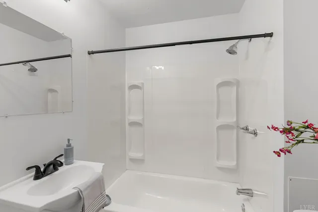 a bathroom with a sink and a shower