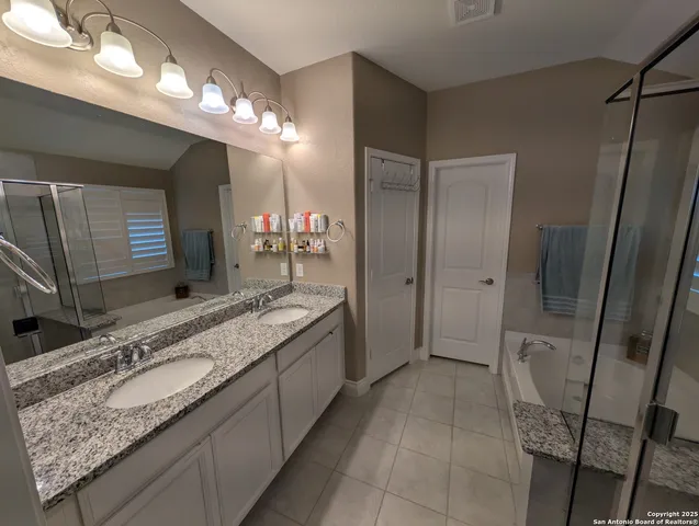 a bathroom with a sink a vanity and a mirror