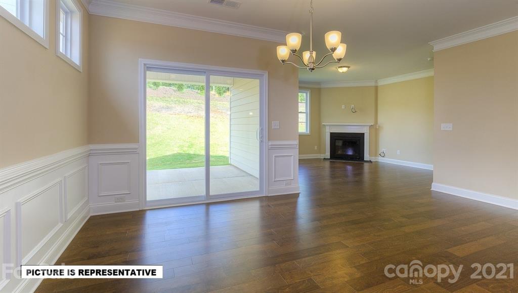 4366 Riverton Loop Denver, NC 28037 - Photo 3 of 14 a view of an empty room with wooden floor and a window