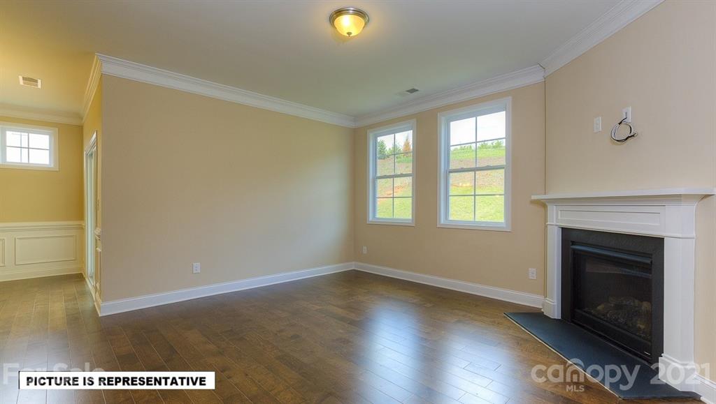 4366 Riverton Loop Denver, NC 28037 - Photo 9 of 14 a view of an empty room with window and fire place