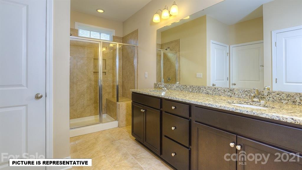 4366 Riverton Loop Denver, NC 28037 - Photo 10 of 14 a bathroom with a granite countertop sink and a mirror