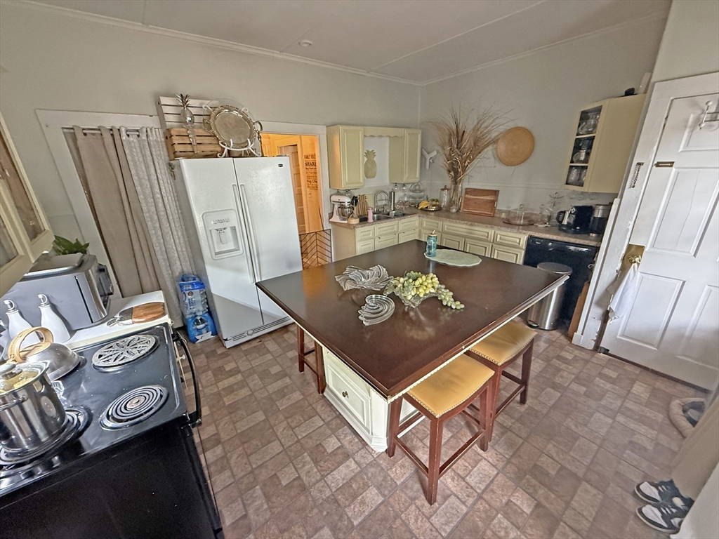 53 Temple Street Whitman, MA 02382 - Photo 11 of 14 a living room with furniture and a table