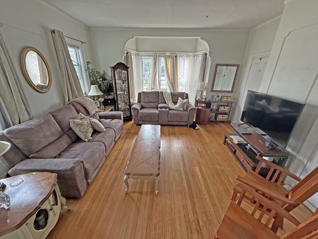 53 Temple Street Whitman, MA 02382 - Photo 12 of 14 a living room with furniture and a flat screen tv