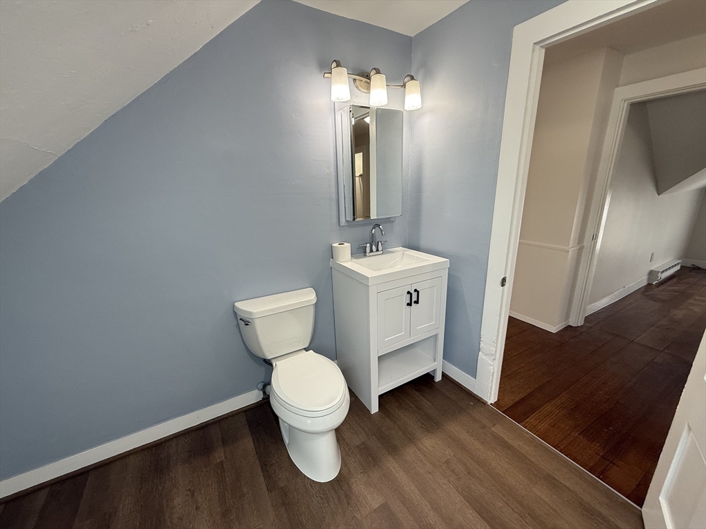 53 Temple Street Whitman, MA 02382 - Photo 10 of 14 a bathroom with a toilet sink and mirror