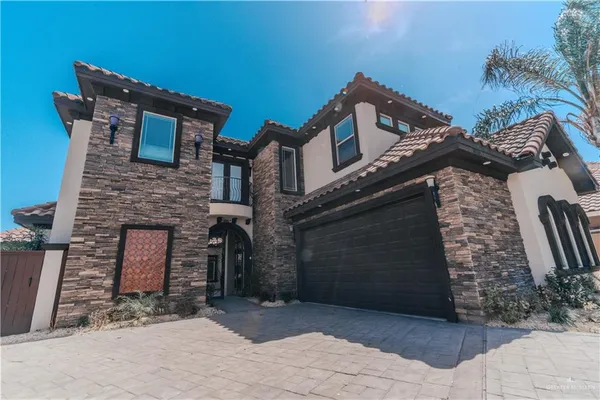 a front view of a house with parking space