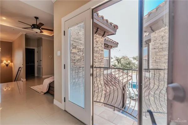 a bedroom with a bed flat screen tv and a couch