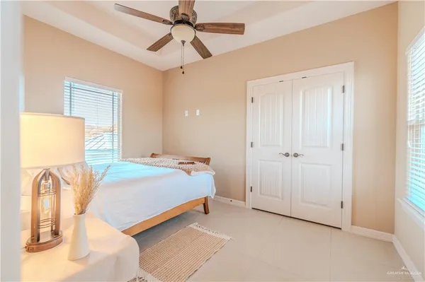 a living room with furniture a rug and a chandelier