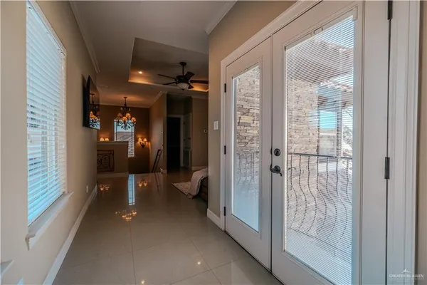 a large bathroom with a sink mirror and a bath tub