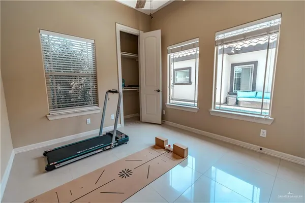 a room with gym equipment and a window