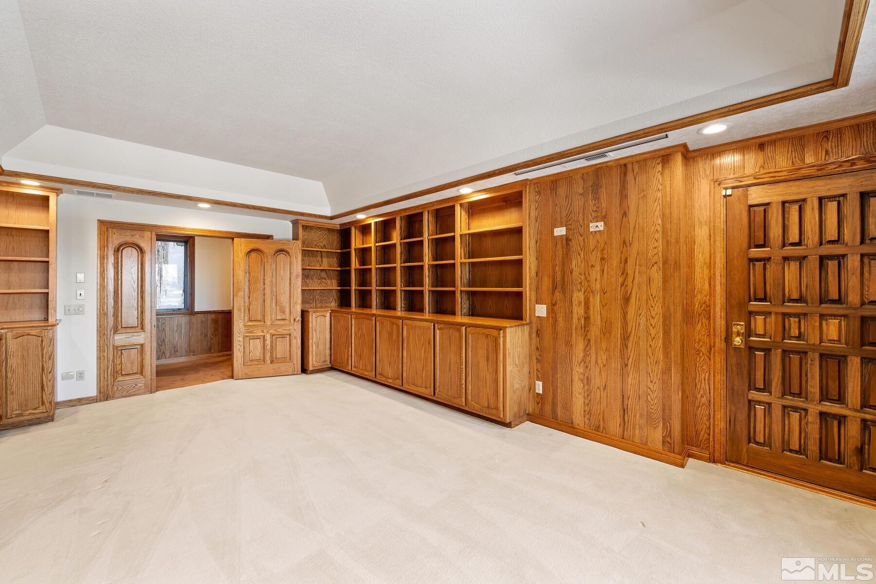 202 Pine Tree Lane Glenbrook, NV 89413 - Photo 11 of 40 a view of an empty room with furniture and staircase