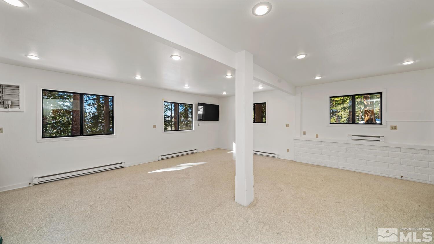 202 Pine Tree Lane Glenbrook, NV 89413 - Photo 22 of 40 an empty room with a empty space and windows